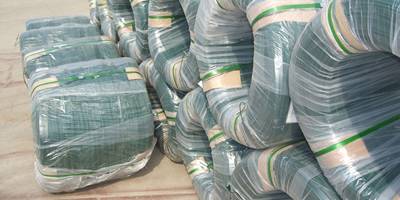 Several rolls of PVC coated wires with plastic film package on the ground.