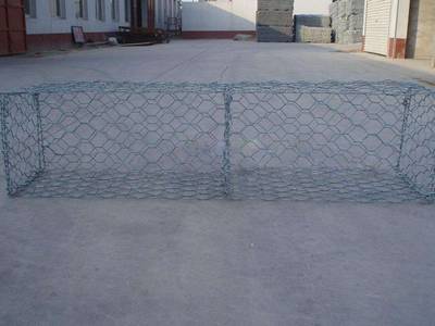 A green color PVC coated gabion mattress on the ground.