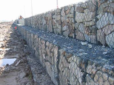 Three layers of PVC coated gabions are installed in the riverway.