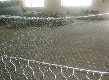 Galvanized mesh gabion box installed in workshop.