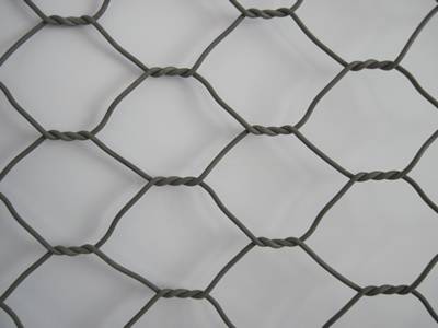 A piece of gray color PVC coated gabions on the ground.