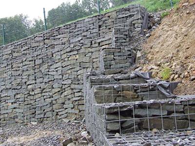 Several welded gabions are installed on the slope
